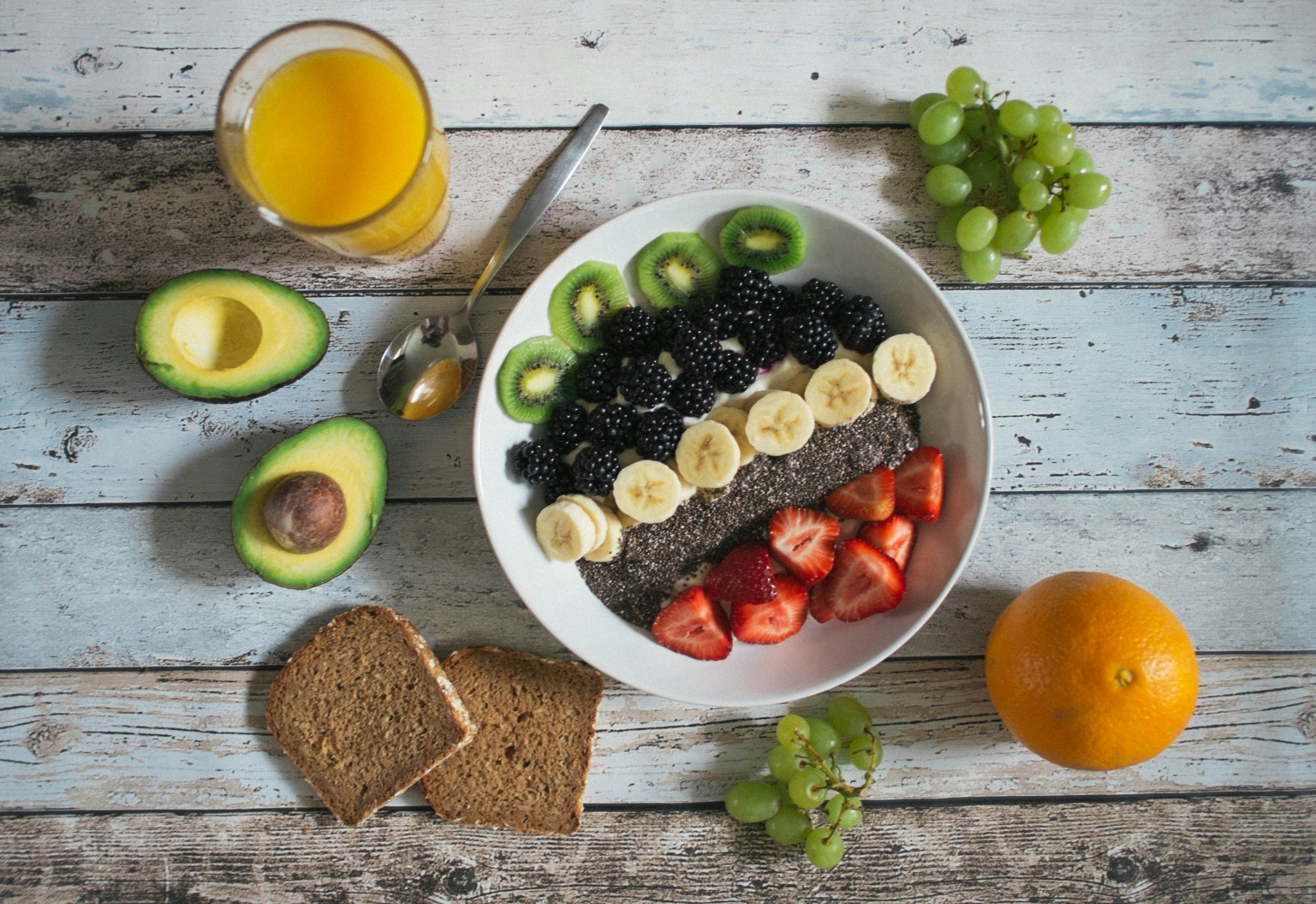 A balanced selection of fruit, wholegrain food and a nutritious breakfast bowl